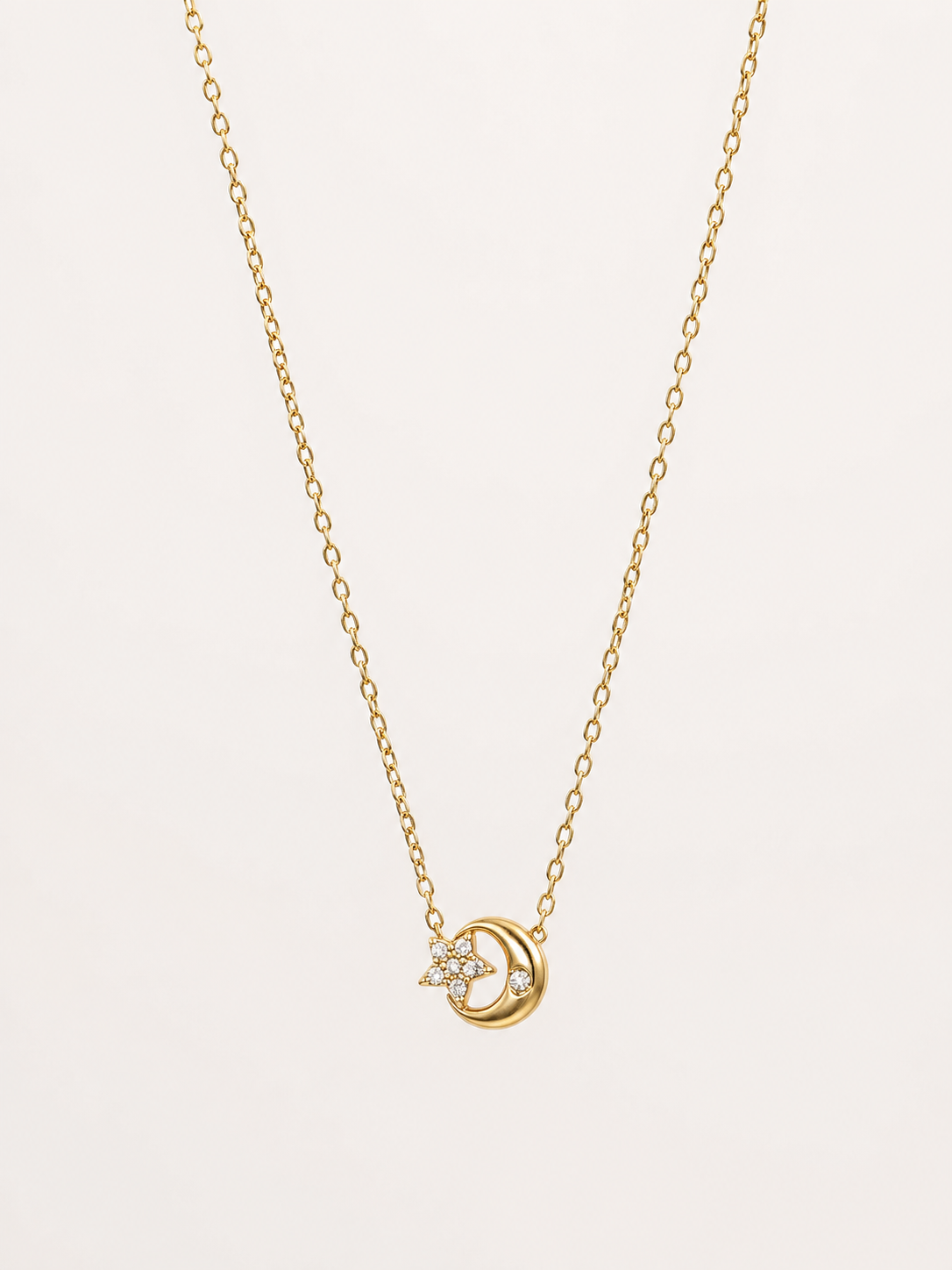Colar malha fininha com estrelinha e lua com brilhantes | Dourado