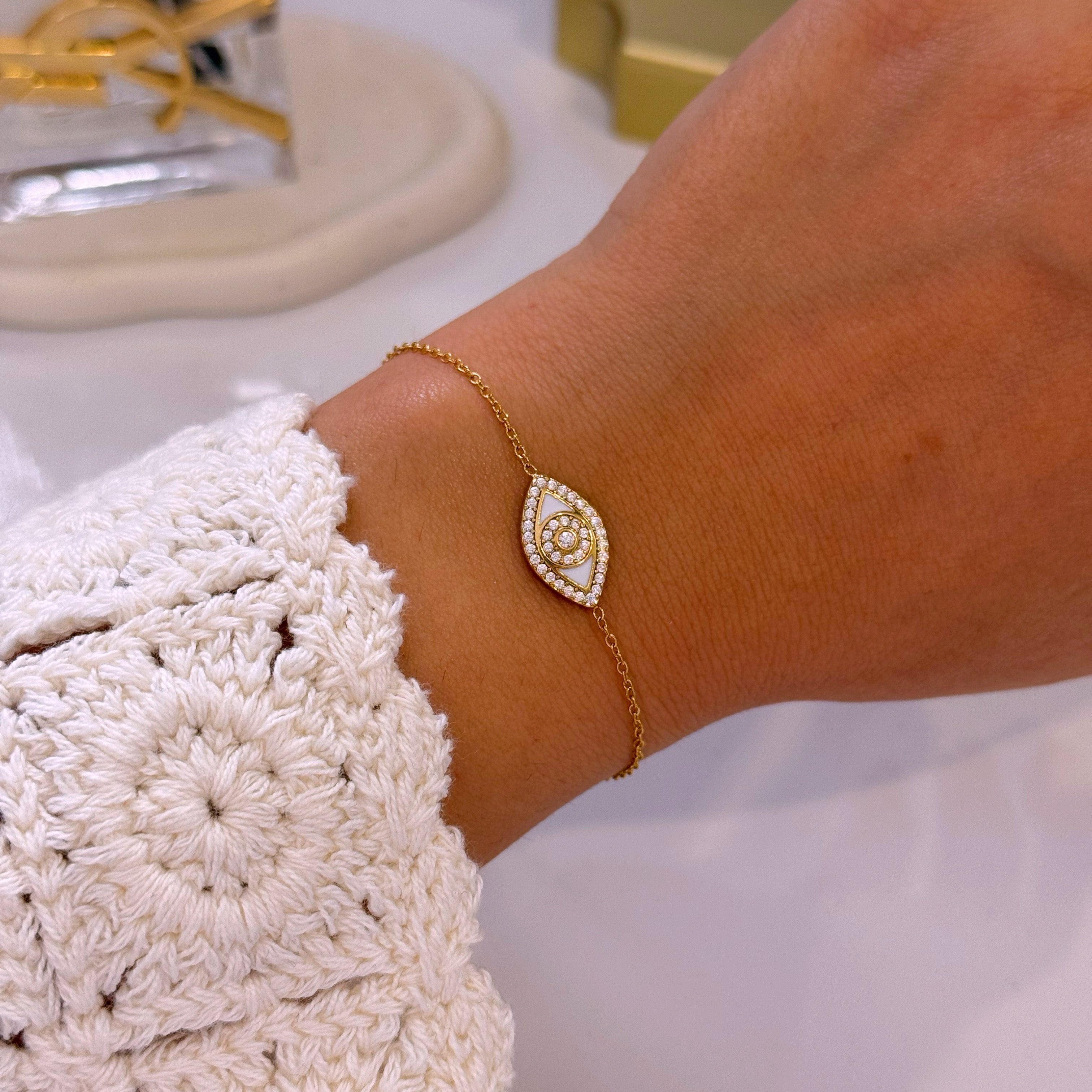 Pulseira olho grego com esmalte branco e brilhantes | Dourado