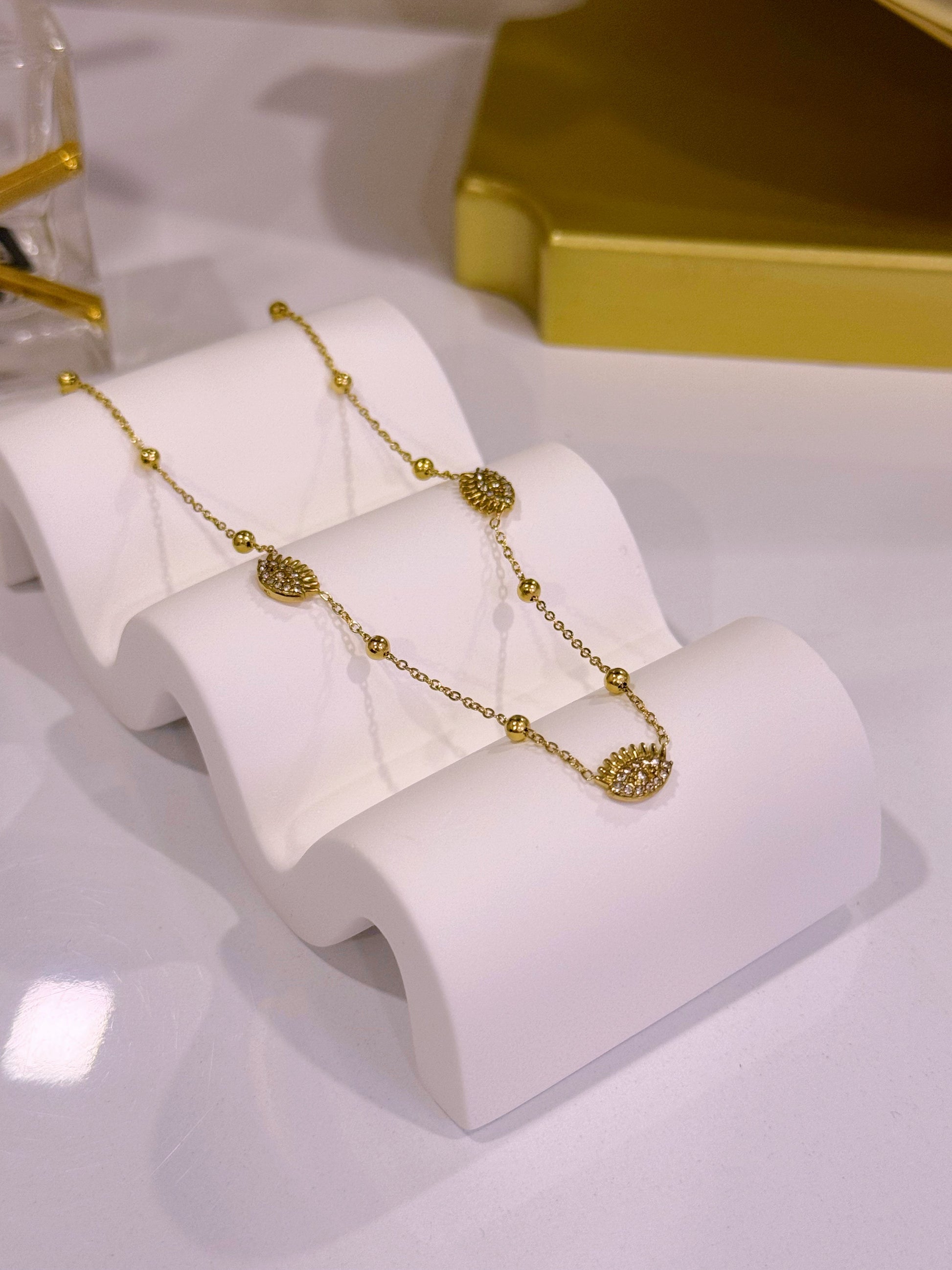 Colar com olho grego e brilhantes | Dourado