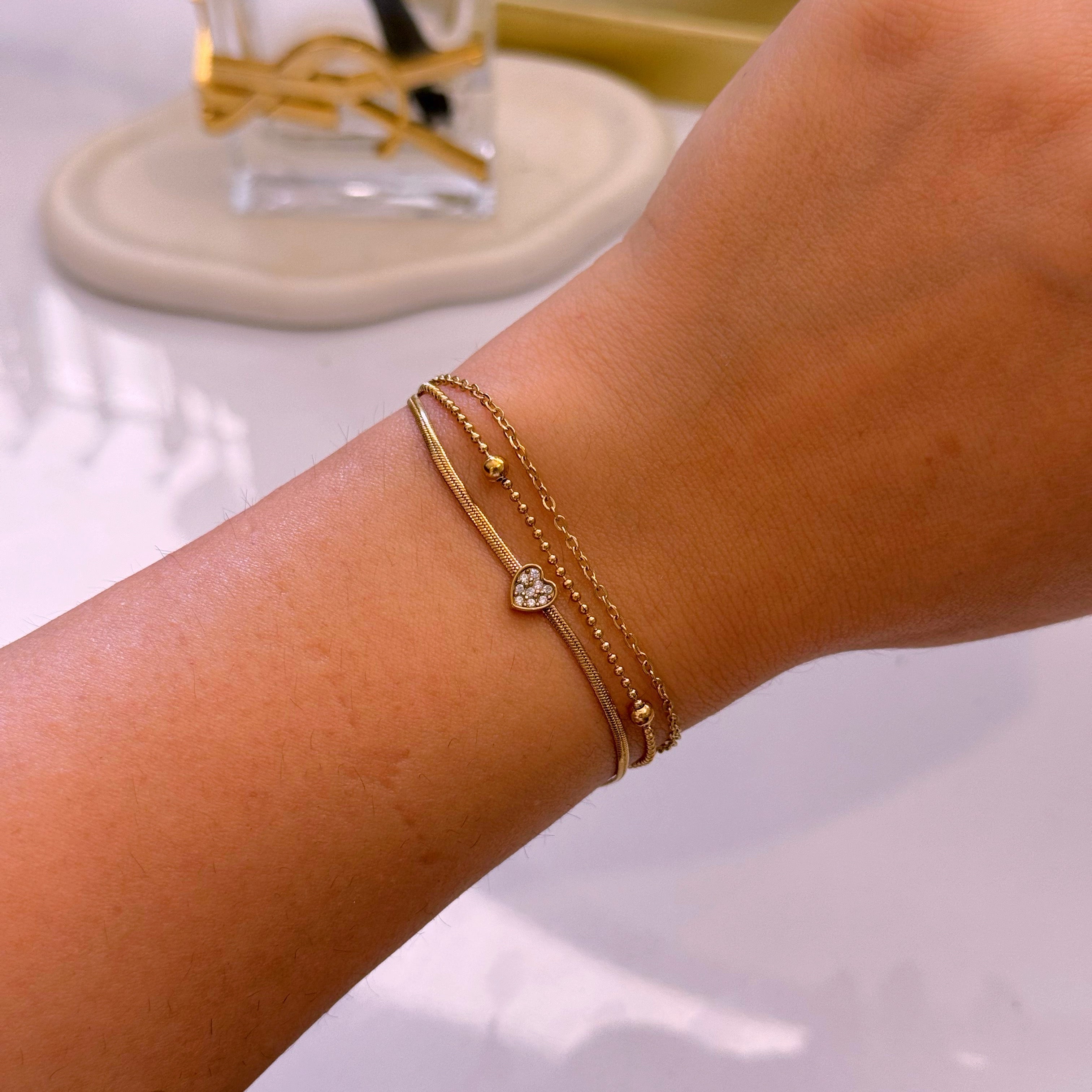 Pulseira efeito triplo • malha achatada com coração, fininha e fininha com bolinhas | Dourado