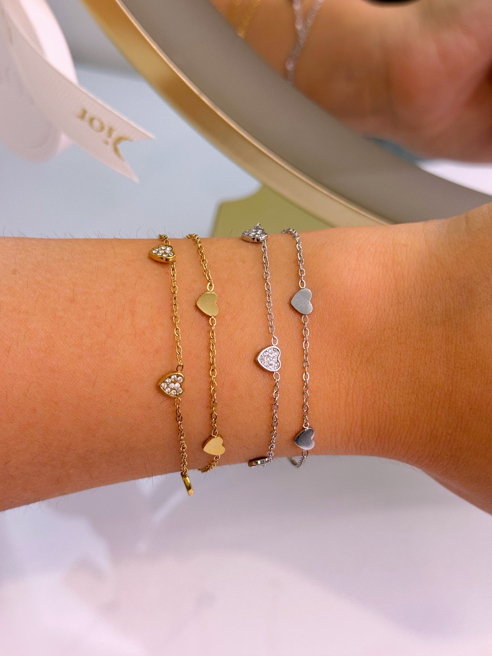 Pulseira efeito duplo com corações lisos e de brilhantes | 2 cores