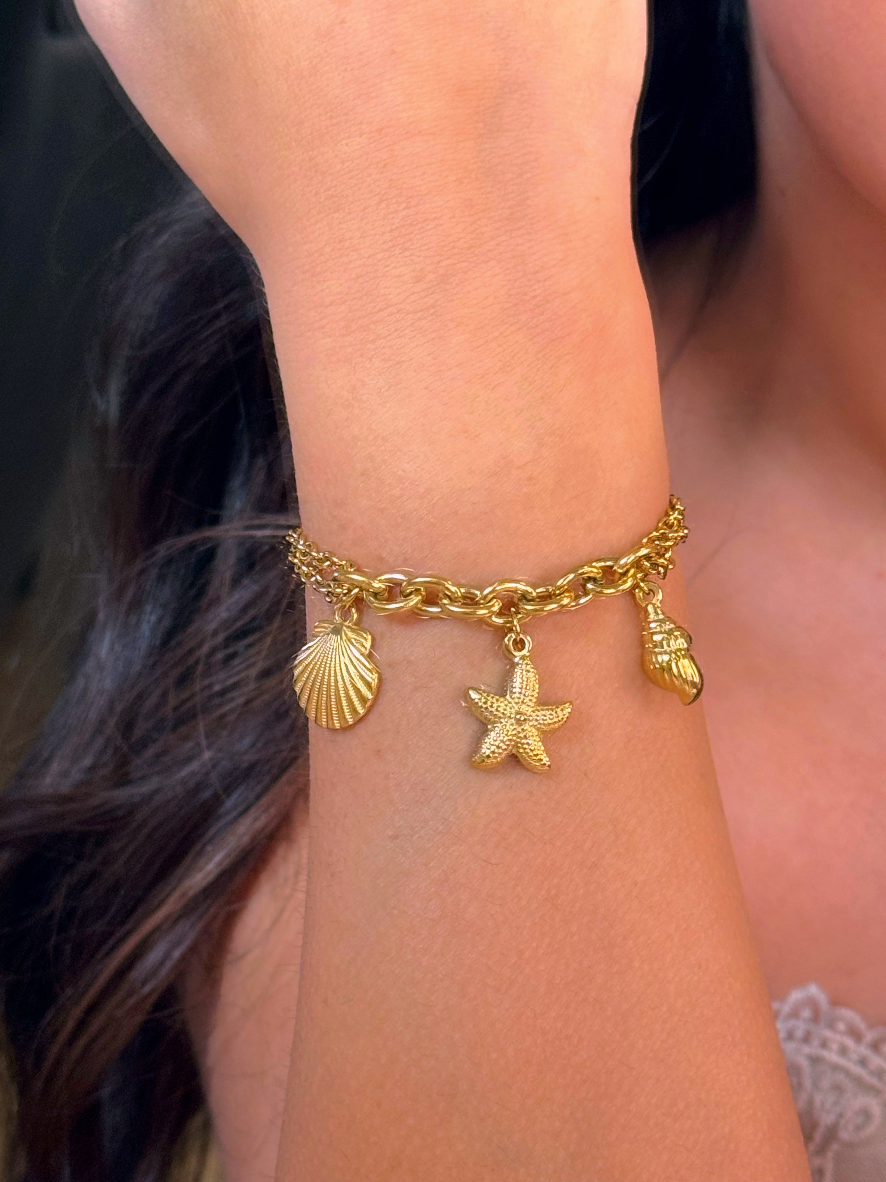 𝐄𝐝𝐢𝐜̧𝐚̃𝐨 𝐋𝐢𝐦𝐢𝐭𝐚𝐝𝐚 𝐕𝐞𝐫𝐚̃𝐨 🐚 Pulseira correntes com concha, estrela e búzio | Dourado