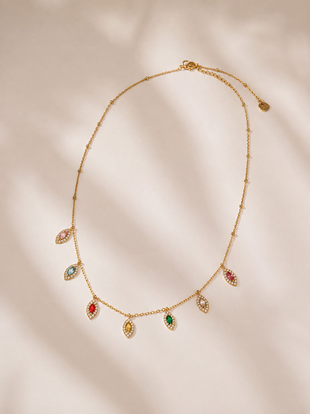 Colar olho grego com 7 brilhantes coloridos | Dourado