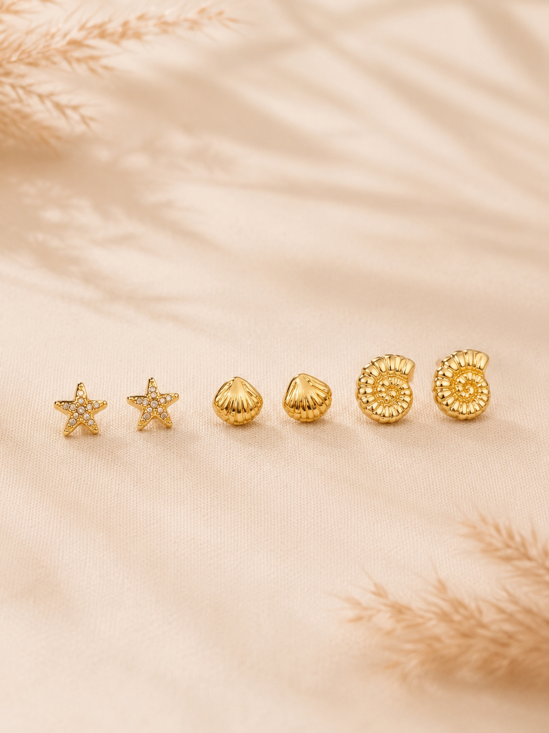 Conjunto de 6 brincos conchinha , estrelinha e búzio | Dourado em aço inoxidável