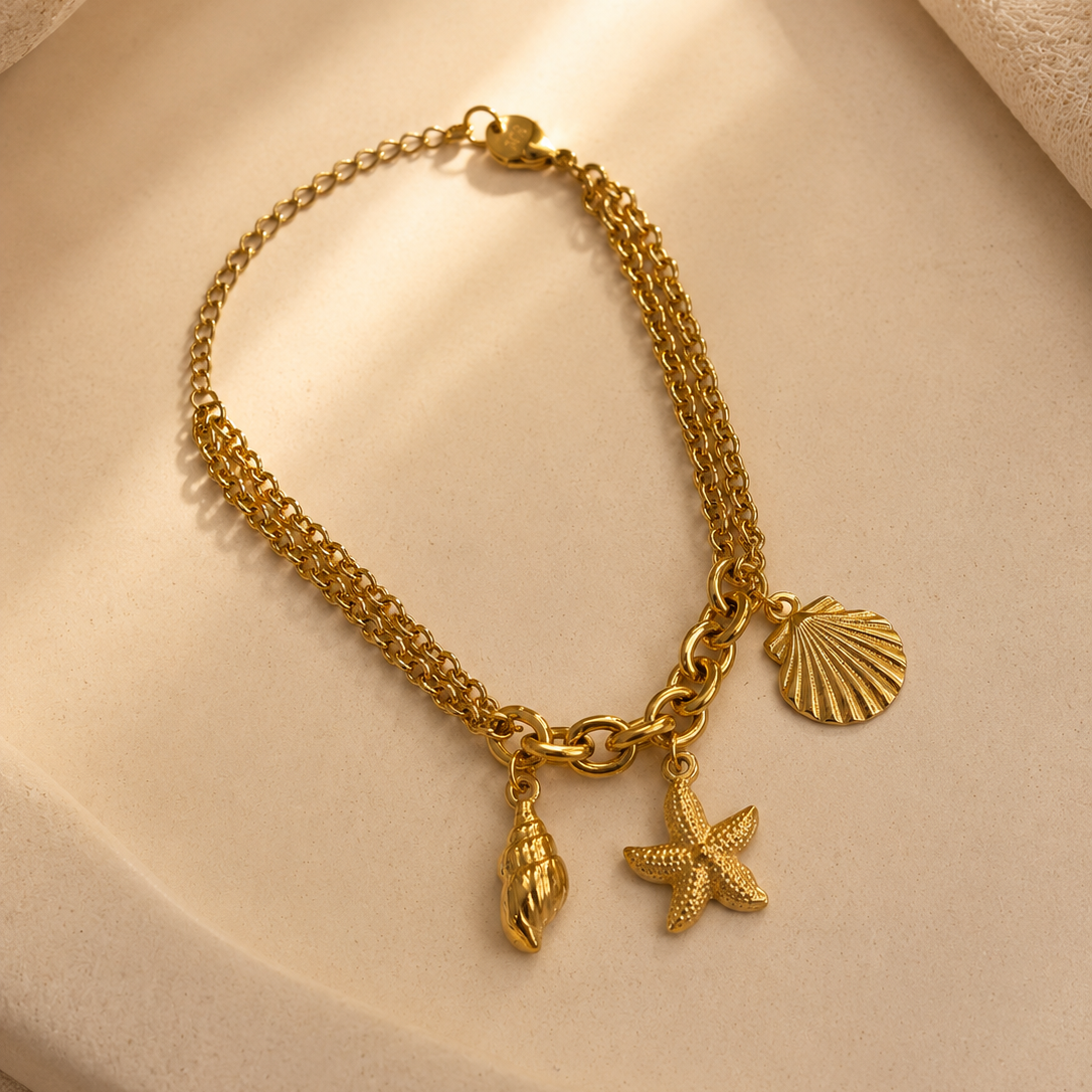 𝐄𝐝𝐢𝐜̧𝐚̃𝐨 𝐋𝐢𝐦𝐢𝐭𝐚𝐝𝐚 𝐕𝐞𝐫𝐚̃𝐨 🐚 Pulseira correntes com concha, estrela e búzio | Dourado